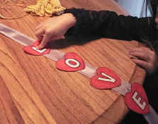glue hearts to ribbon
