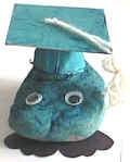 pet rock grad with egg carton cap