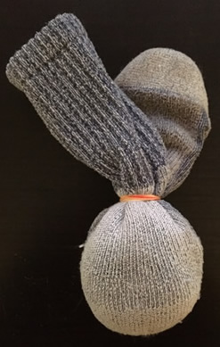 tie or use an elastic to seal the sock