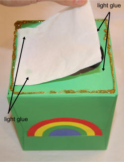 Cut a piece of kleenex to cover the hole and glue it lightly.